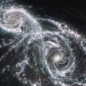 Interacting galaxies NGC 2207 and IC 2163 in Canis Major courtesy of NASA, ESA, CSA, STScI