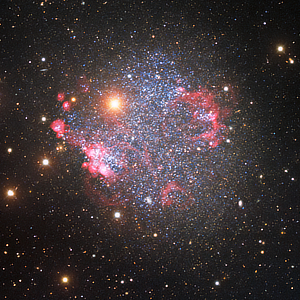 A glittering image of irregular dwarf galaxy Sextans A captured by the Nicholas U. Mayall 4-meter Telescope at Kitt Peak National Observatory courtesy of KPNO/NOIRLab/NSF/AURA.