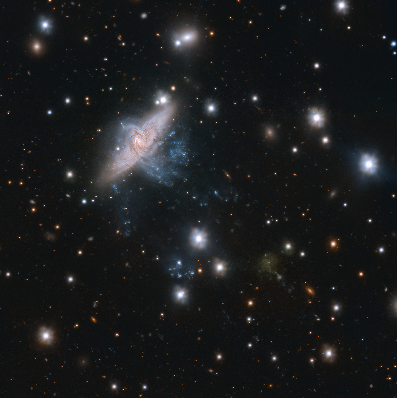 An image of the ultra-diffuse galaxy UDG 32 in Hydra to the lower right with the more spectacular galaxy NGC 3314 in the upper left taken by the VLT Survey Telescope courtesy of ESO/Iodice et al.