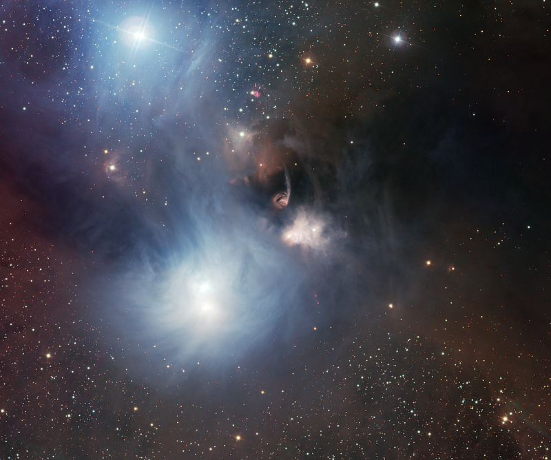 An optical light image of R Coronae Australis and the Coronet Cluster in Corona Australis is courtesy of ESO